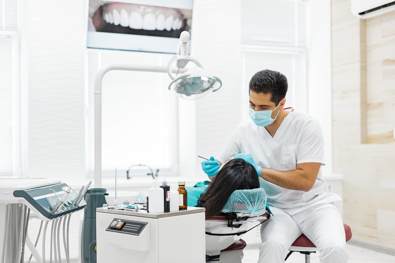 cute-young-girl-is-being-examined-by-dentist.jpg