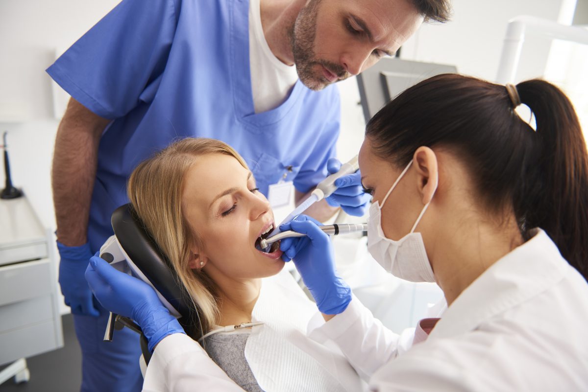 young-woman-is-getting-treatment-dentist-s-office-1200x801.jpg